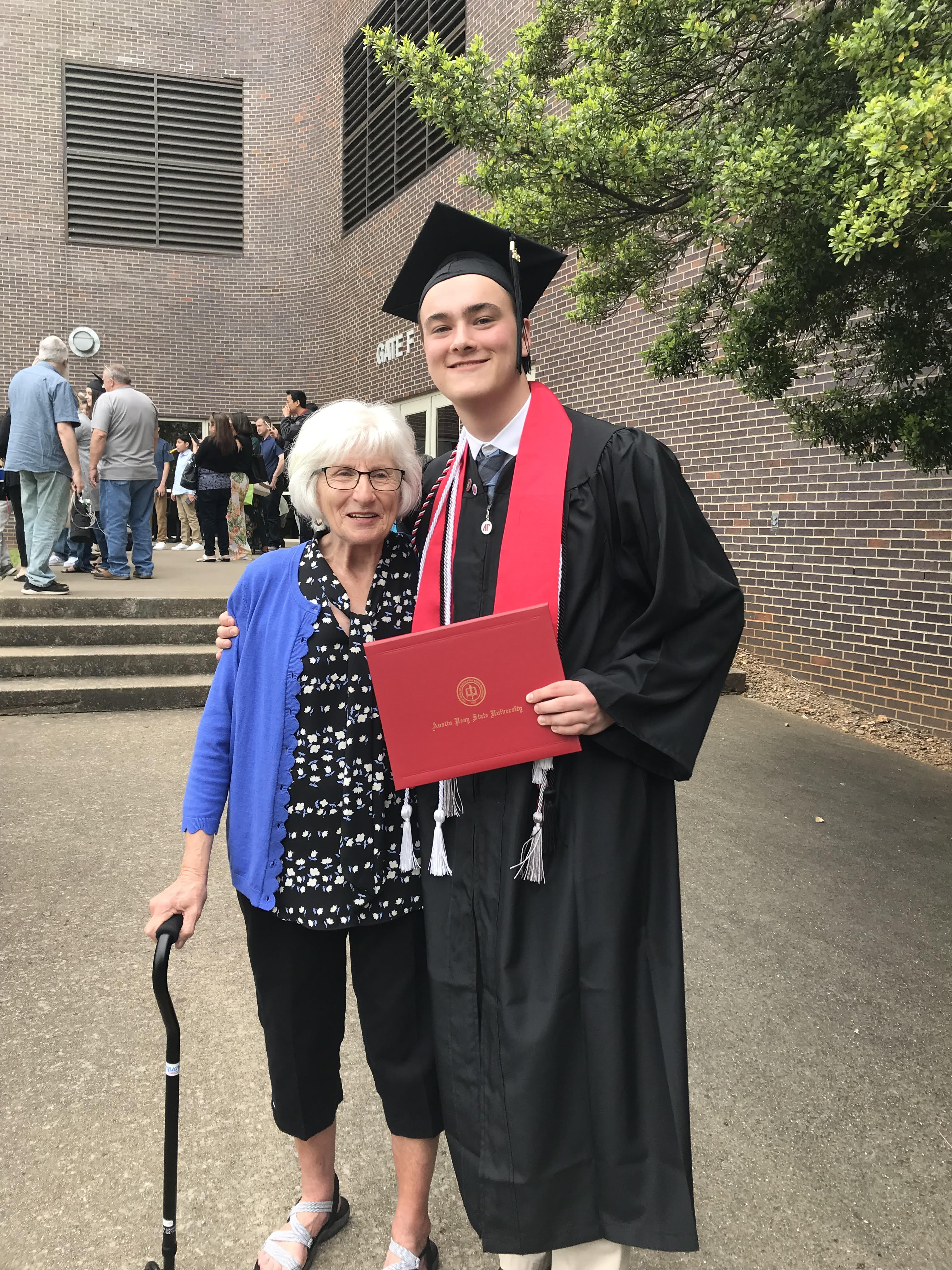 A Picture of me in graduation robes with my Grandma